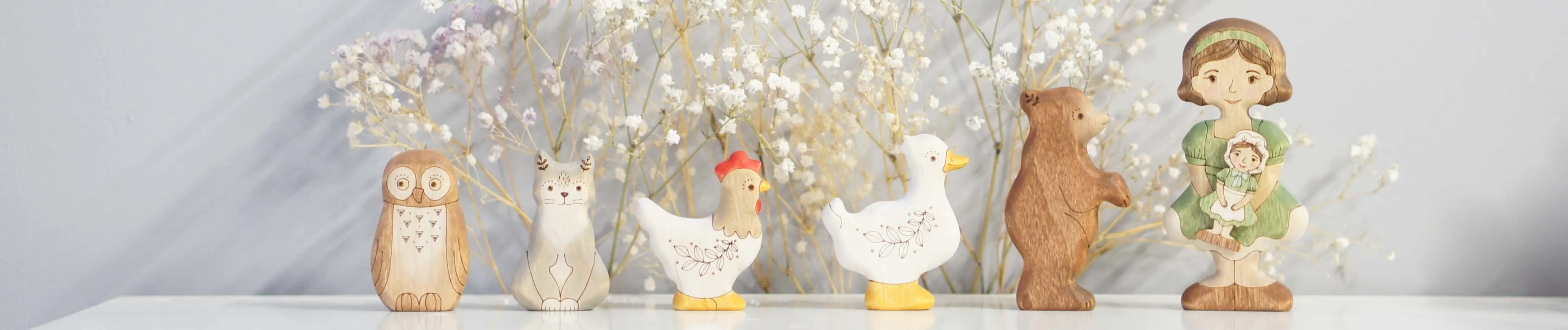 Hand-painted wooden characters from the Tiny Fox Hole workshop