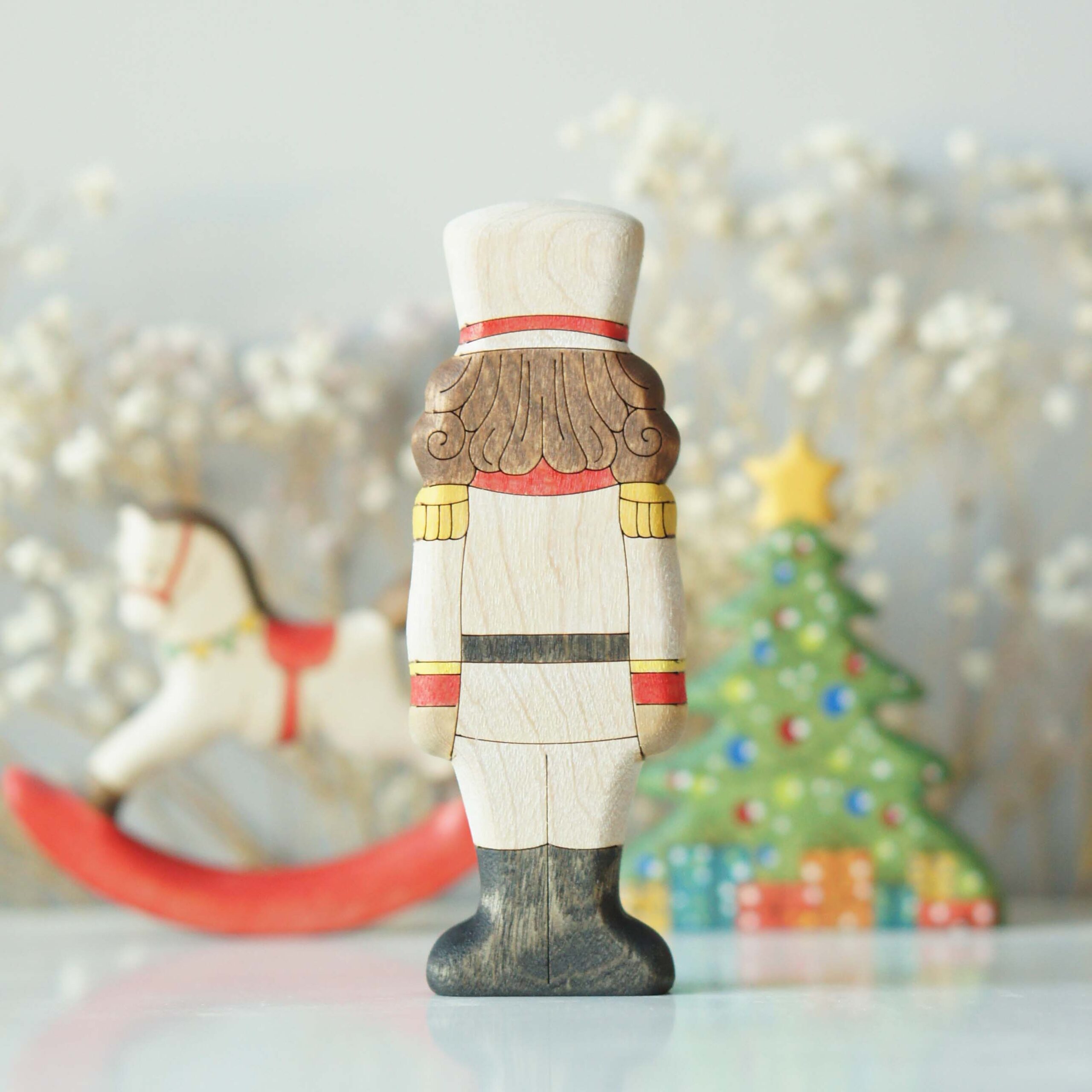 Nutcracker in ivory uniform - back view