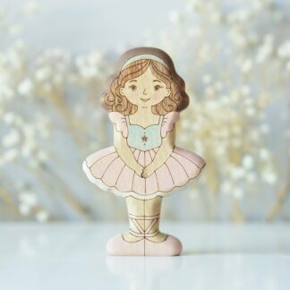 Brunette ballerina in pink - front view