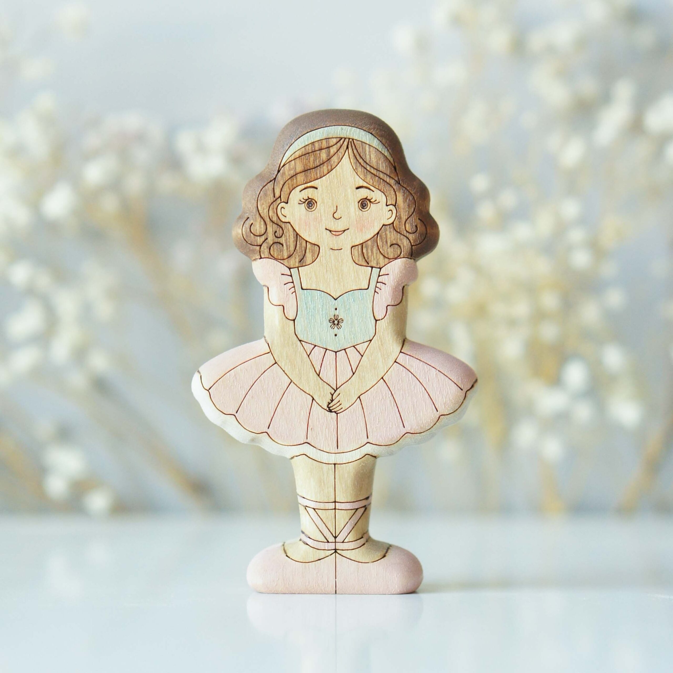 Brunette ballerina in pink - front view