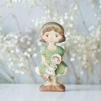 Girl in a Green Dress with a Doll