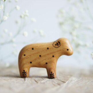 Lamb wooden toy (with a twig on the ear) natural